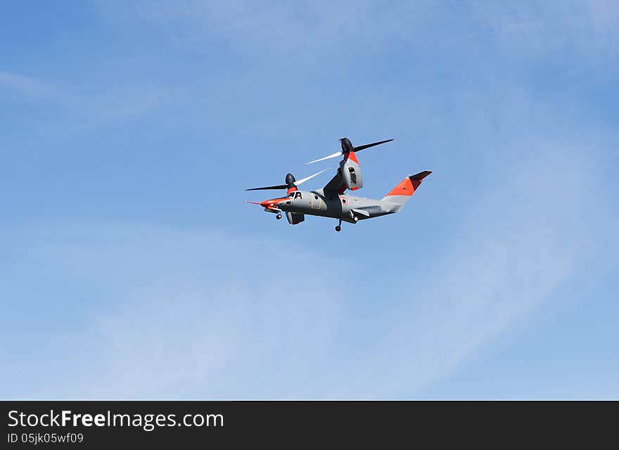 Tiltrotorcraft in the blue sky