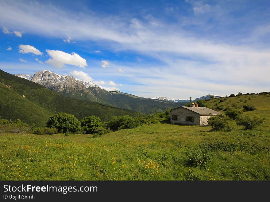 A view of italian alps with isolated house