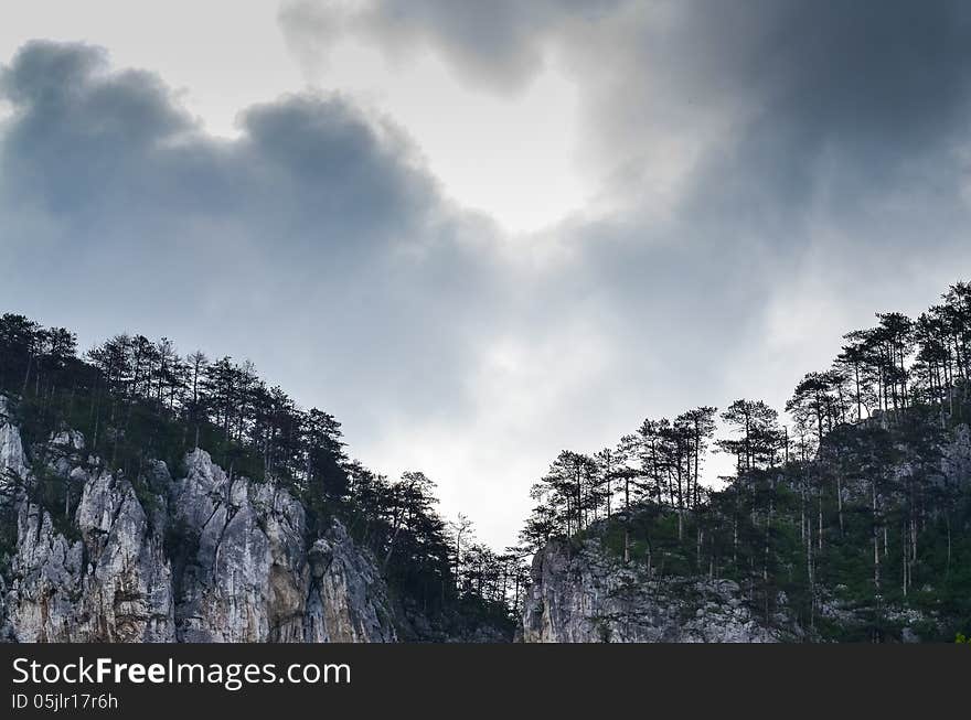 Rocky Mountains on a cloudy day in Mehedinti Mountains, Herculane, Cerna Valley