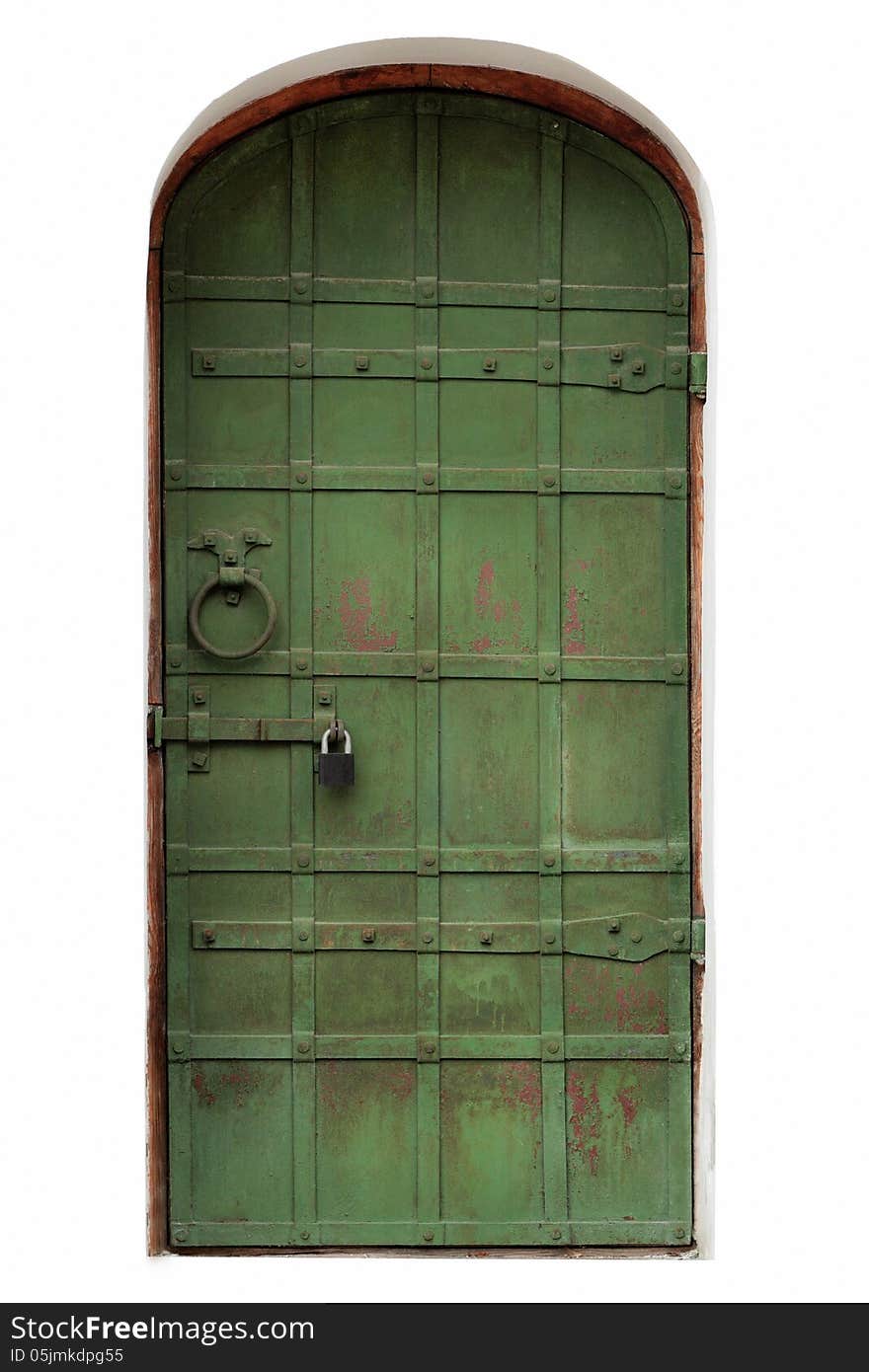 Old metal door on a white wall. Old metal door on a white wall