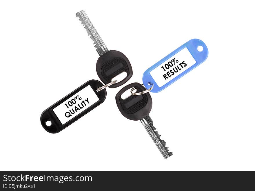 Keys on a white background. Keys with plastic tag. Keys on a white background. Keys with plastic tag