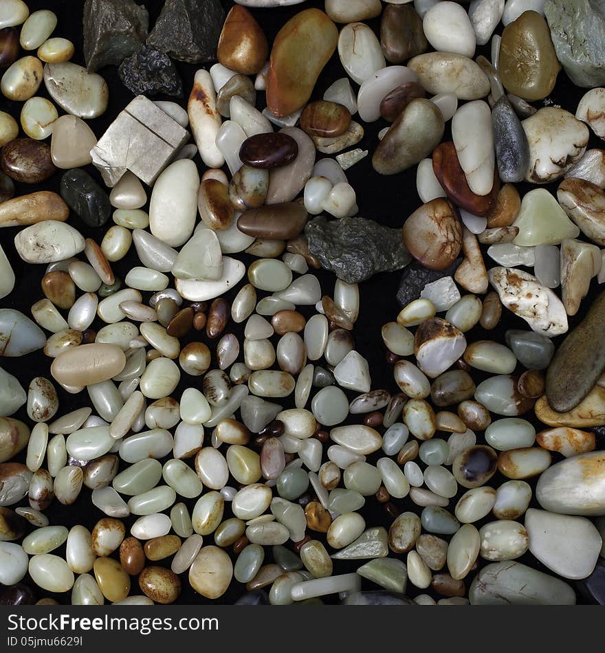 Various sorts of raw jades for sale.