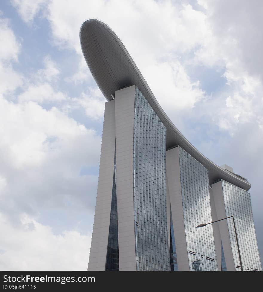 Marina Bay Sands against cloudy sky from bottom view. Singapore