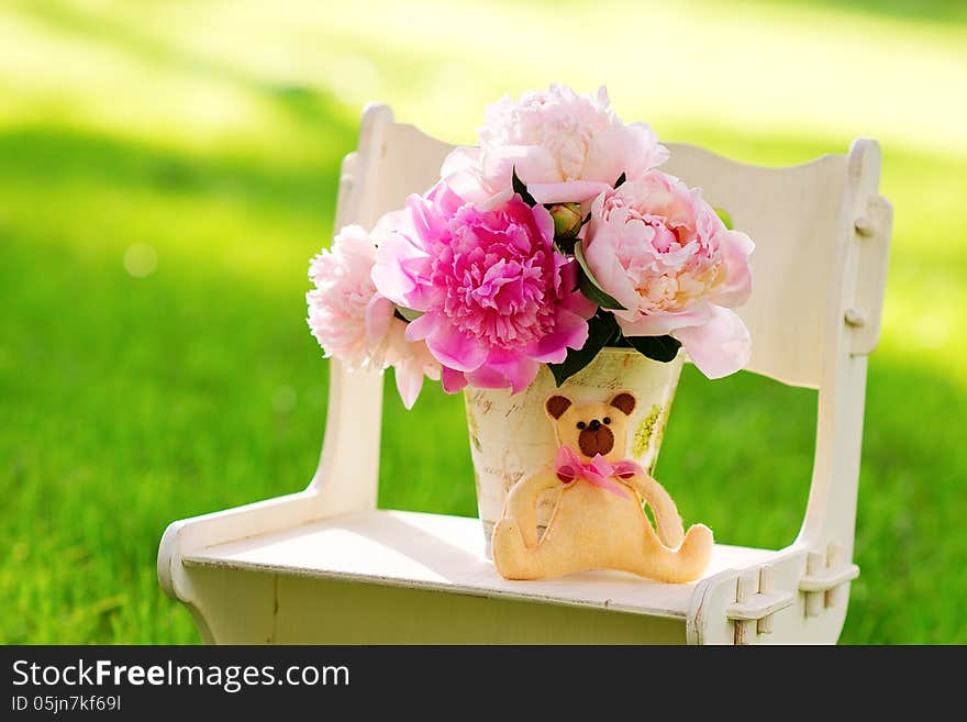 Still life with peonies on the lawn