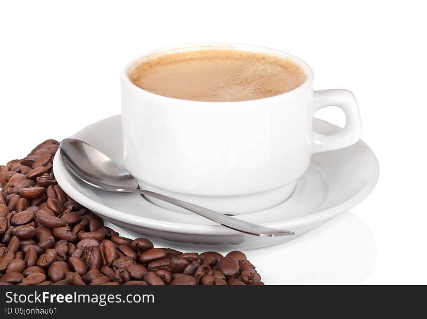 Cup of coffee with coffee beans on white