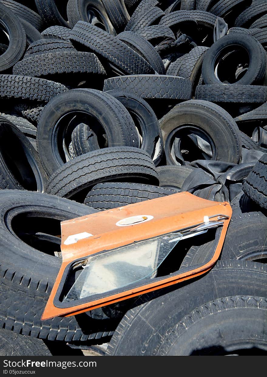 Old used tires in a scrap yard waiting for recycling. Old used tires in a scrap yard waiting for recycling