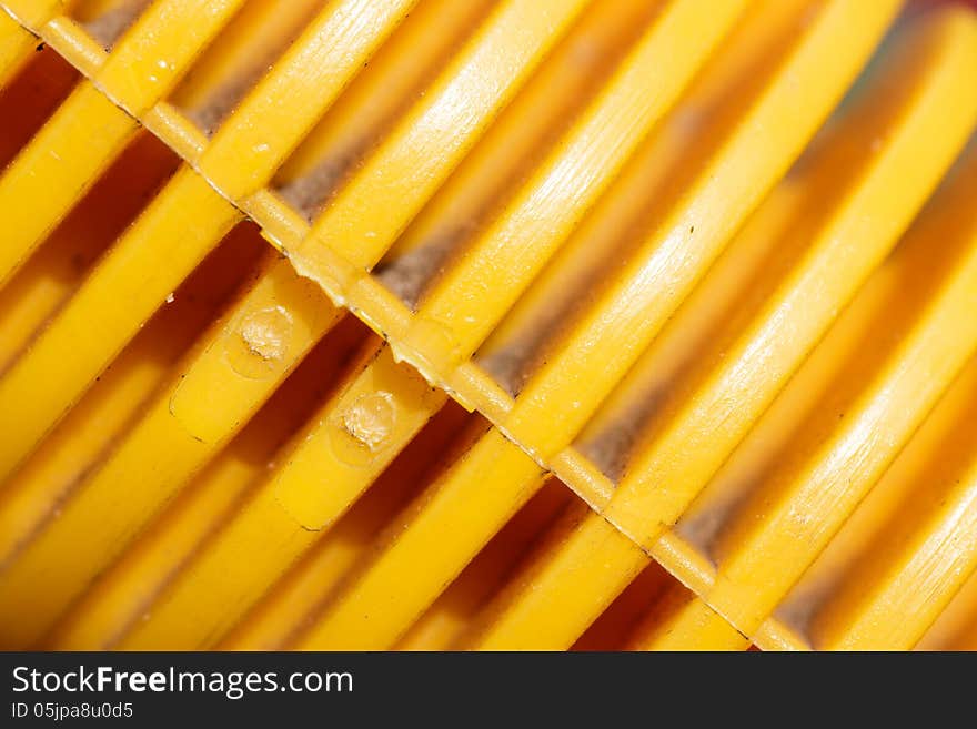 Yellow plastic background. Shiny plastic.