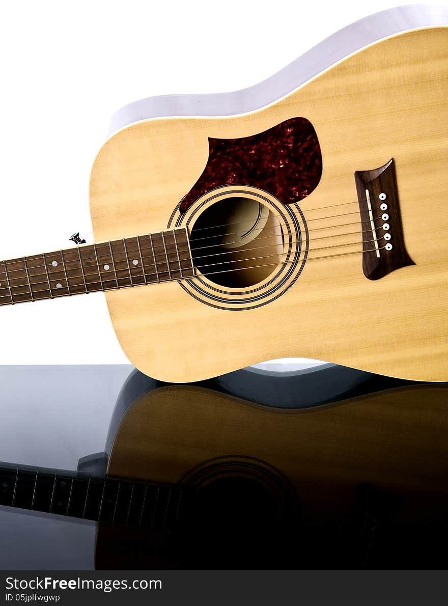 Image of guitar on a glass table. Image of guitar on a glass table