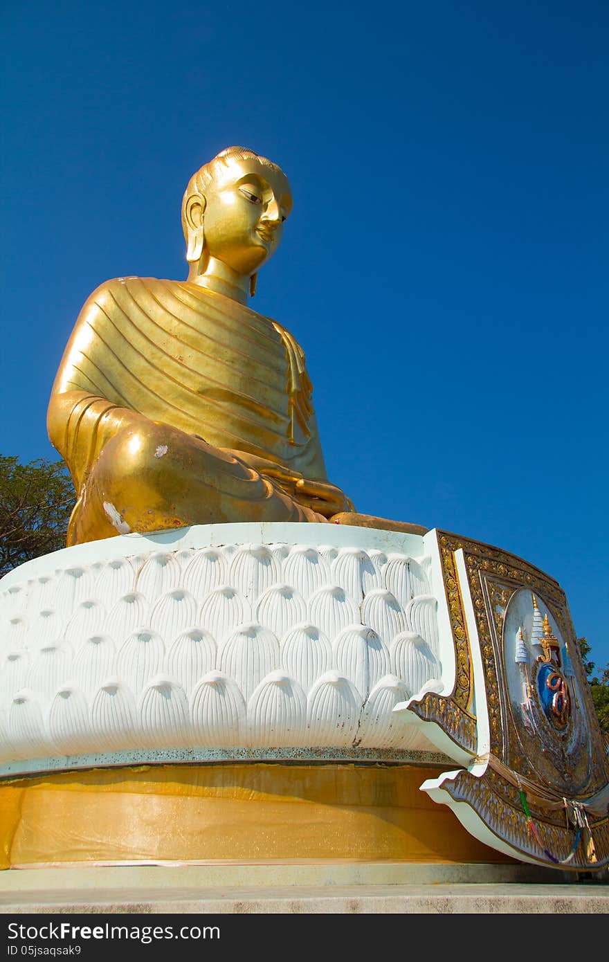 Golden buddha on blue sky. Golden buddha on blue sky