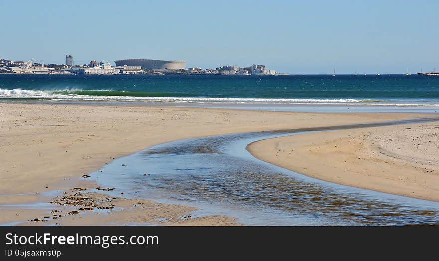 Landscape of Milnerton Lagoon Beach with Cape Town Soccer Stadium in the background