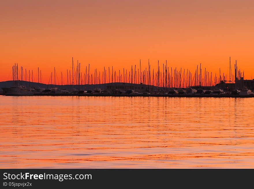 Orange Sky and Boats in Horizon