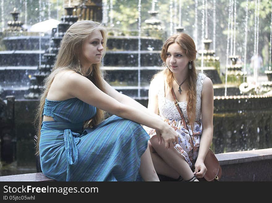 Two Girls Near A Fountain