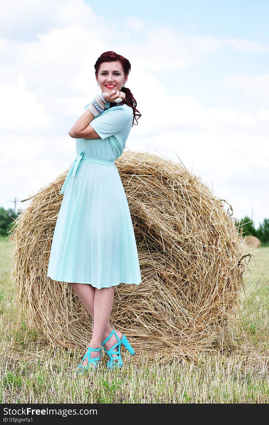 Beautiful Girl Near Haystacks