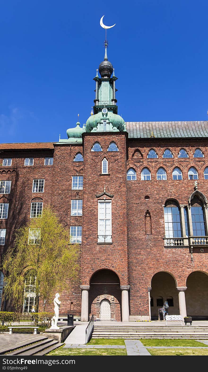 Town hall tower with a spire on the month in Stockholm. Sweden. Town hall tower with a spire on the month in Stockholm. Sweden