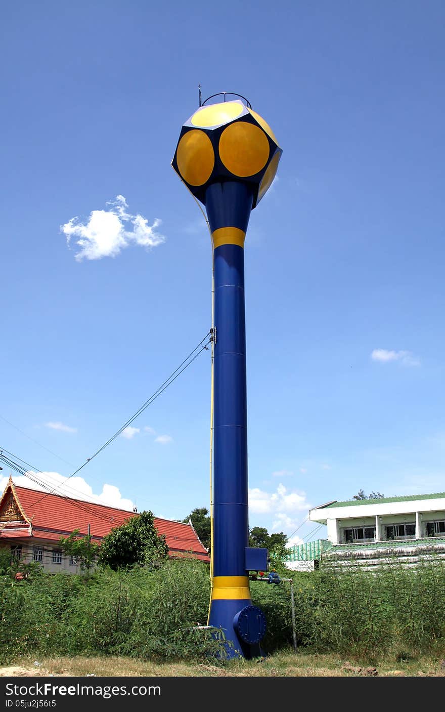 Blue public water tank hold up to blue sky