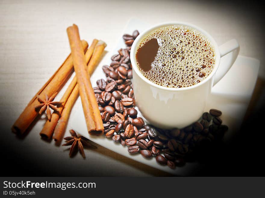 Cinnamon,anise with coffee beans white a cup coffee. Cinnamon,anise with coffee beans white a cup coffee