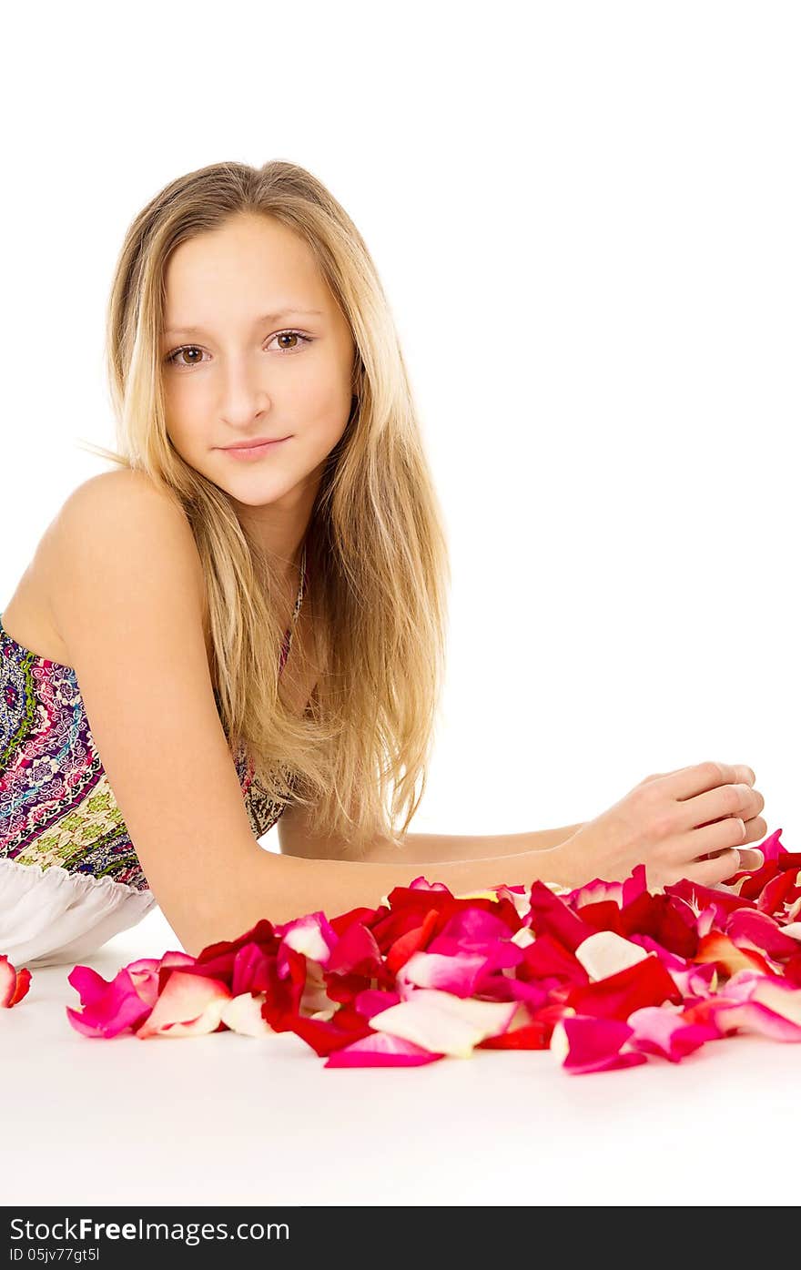 Healthy skin, the girl lies with rose petals