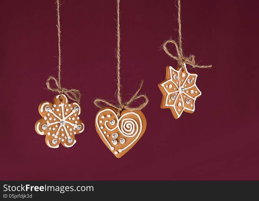 Christmas gingerbreads hanging in traditional linen string