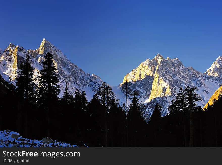 snowy mountains forest landscape blue sky. snowy mountains forest landscape blue sky