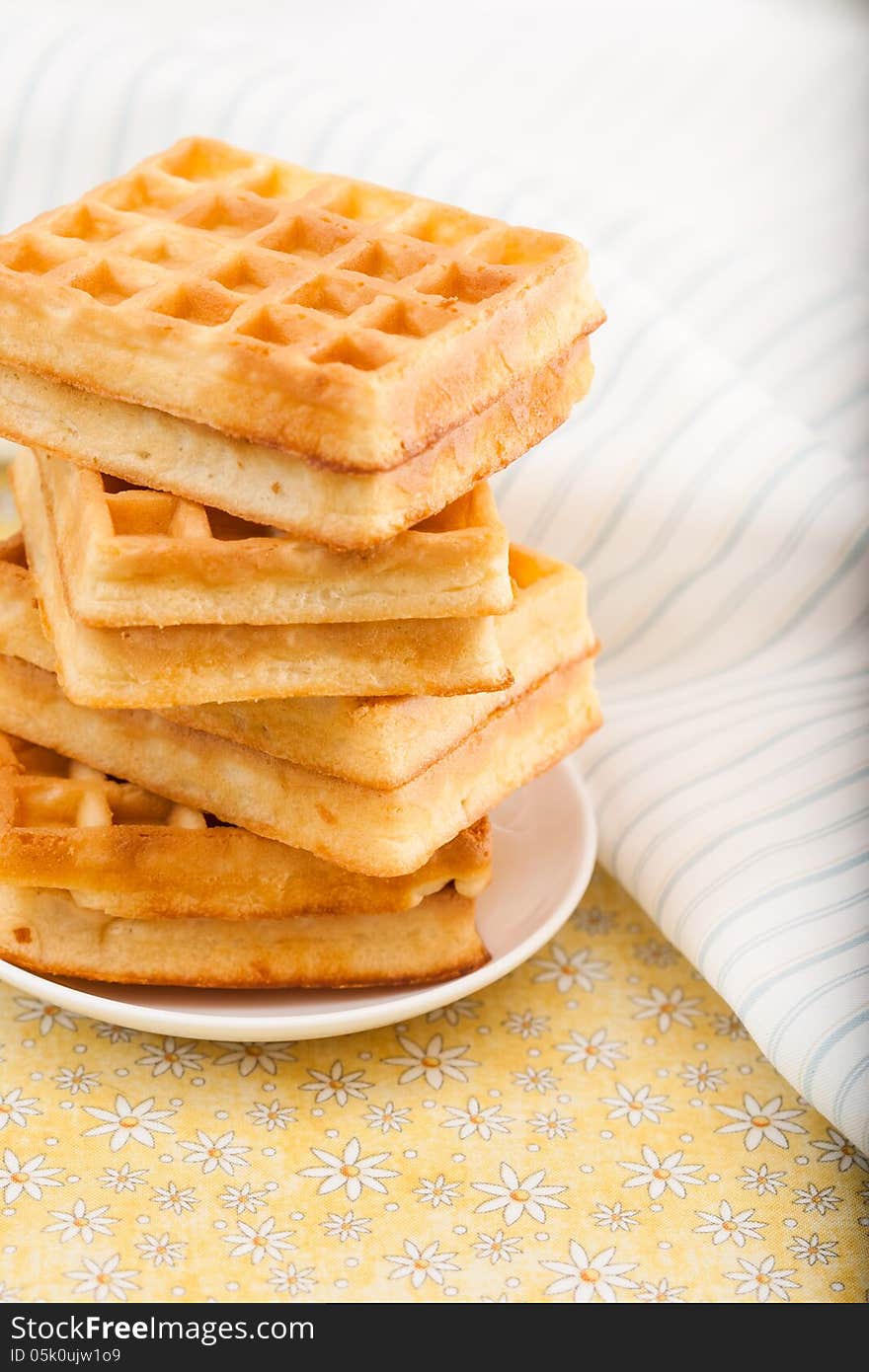 Sweet Belgian waffles on a plate. Sweet Belgian waffles on a plate