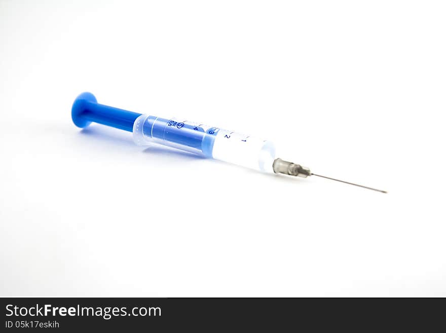 Syringe on White