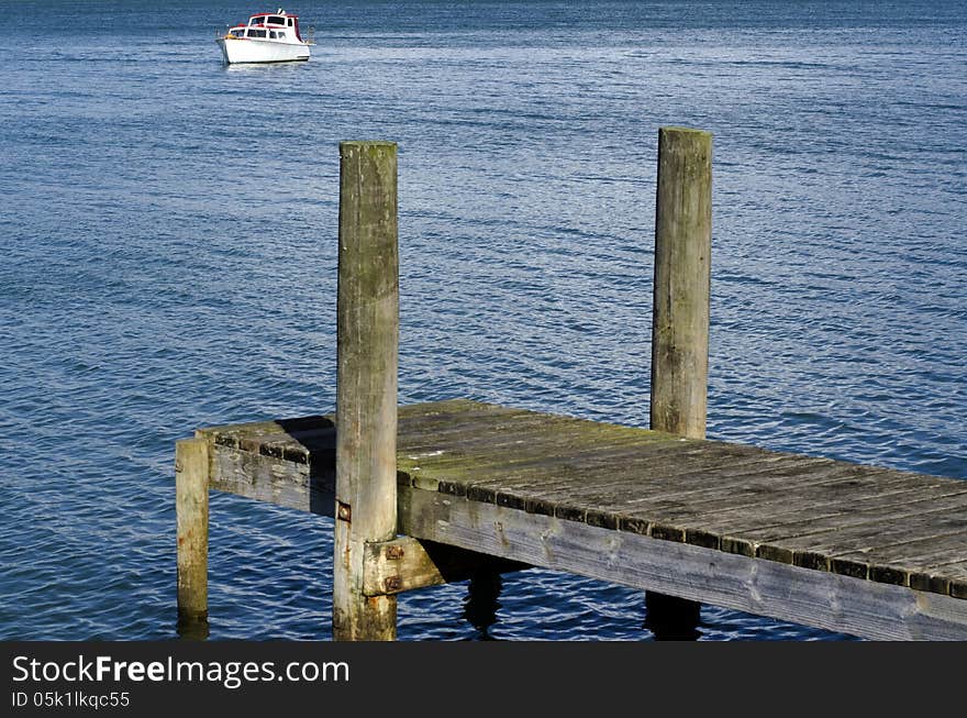 Small boat pier on a body of water.