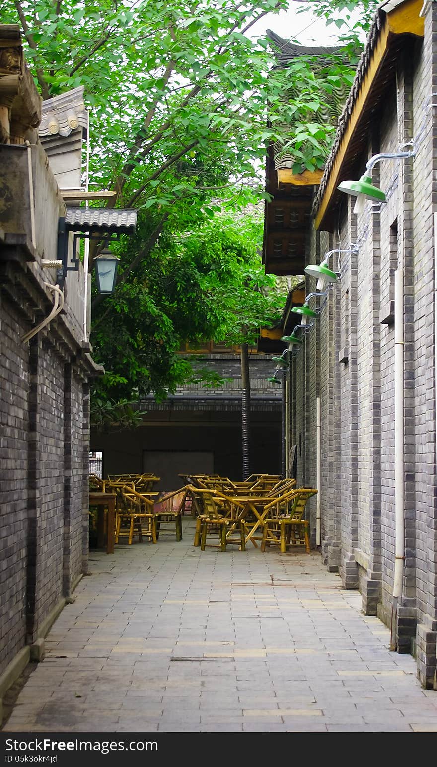 Traditional styled alley and chairs where local Chinese gather for leisure and tea and playing mahjong. Traditional styled alley and chairs where local Chinese gather for leisure and tea and playing mahjong