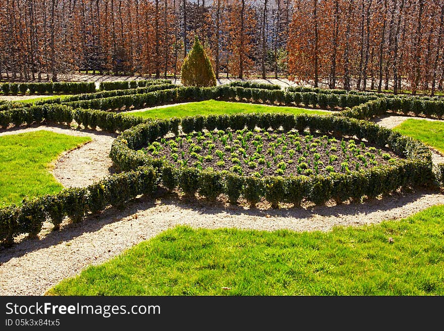 Ornate flower bed in the Baroque garden in Prague, Czech republic. Horizontal position. Ornate flower bed in the Baroque garden in Prague, Czech republic. Horizontal position.