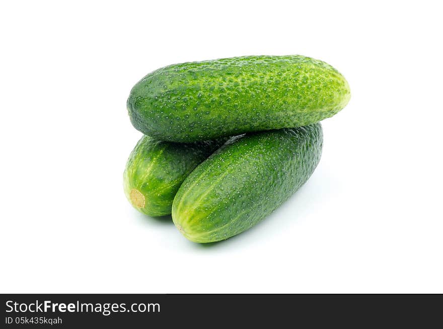 Stack of Perfect Raw Cucumbers isolated on white background