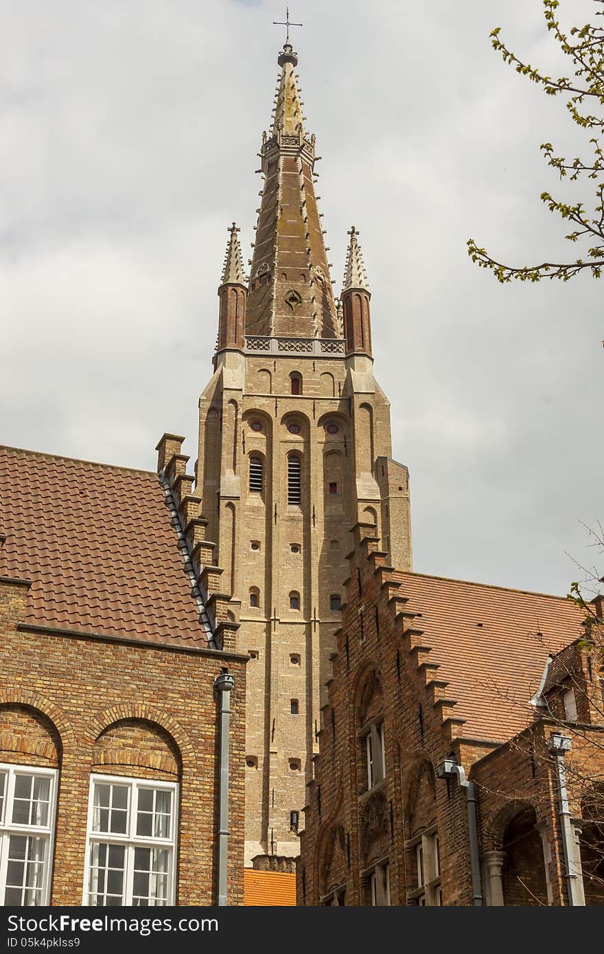 View on bell tower of Our Lady Church in UNESCO town - Brugge, Belgium. View on bell tower of Our Lady Church in UNESCO town - Brugge, Belgium.