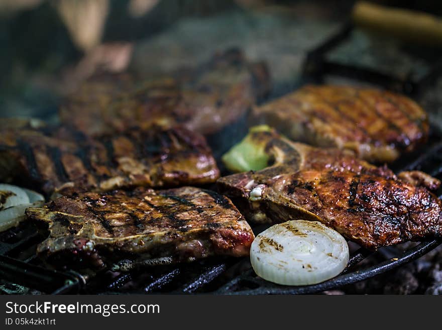 Meat steak on grill with vegetables