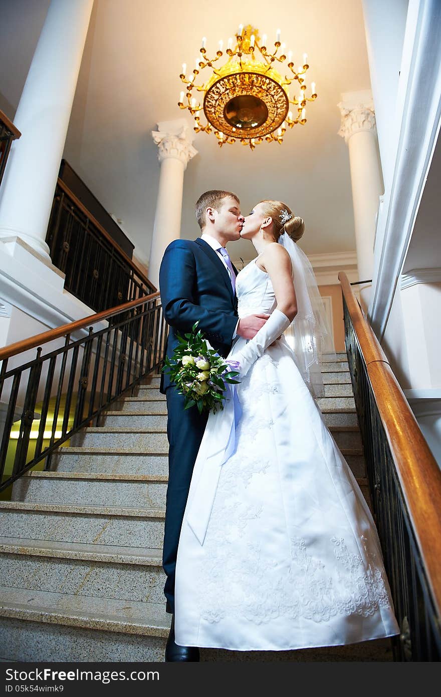 Happy bride and groom kissing