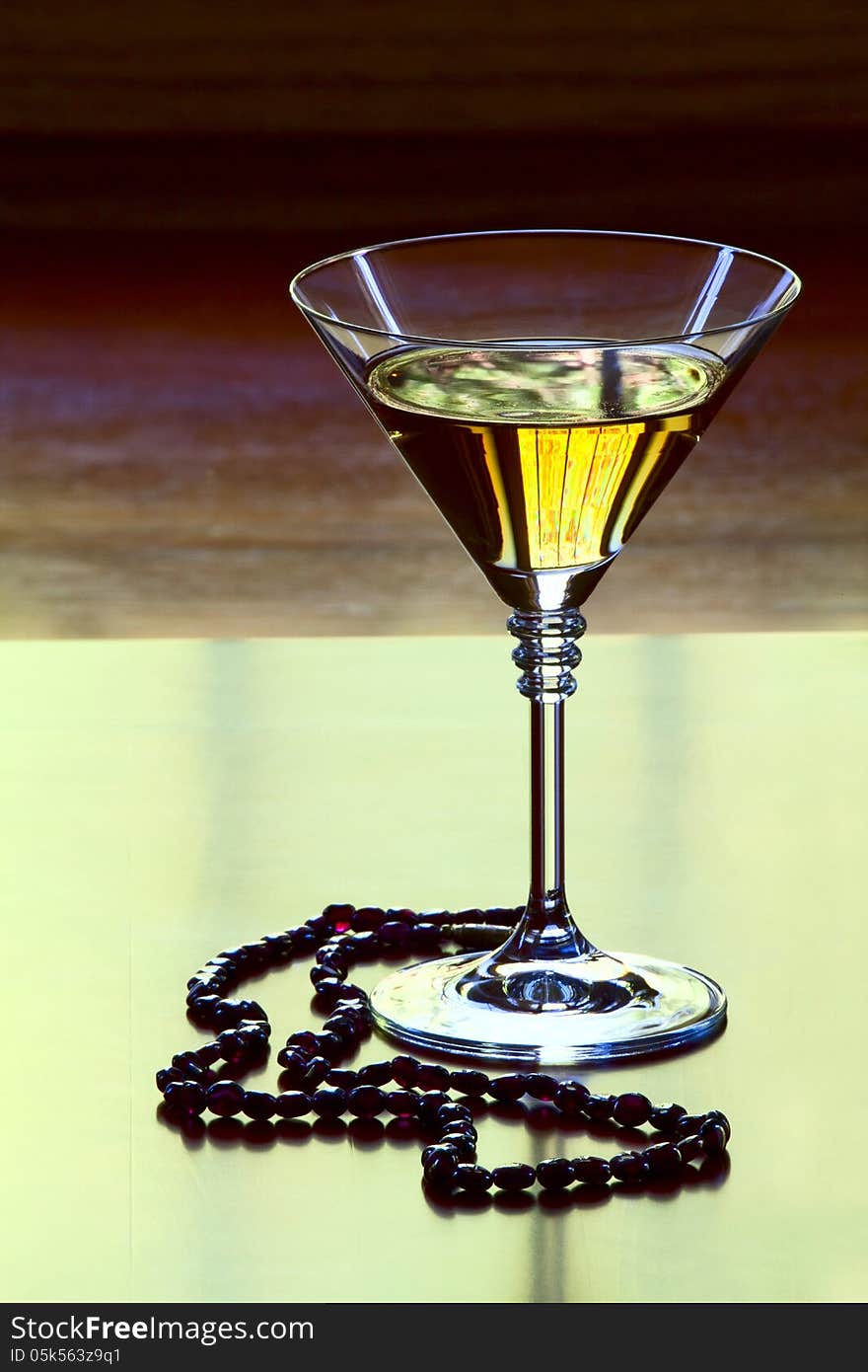 Garnet necklace and a glass with wine