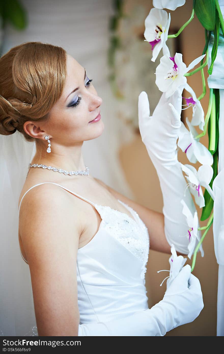 Happy beautiful bride with flowers