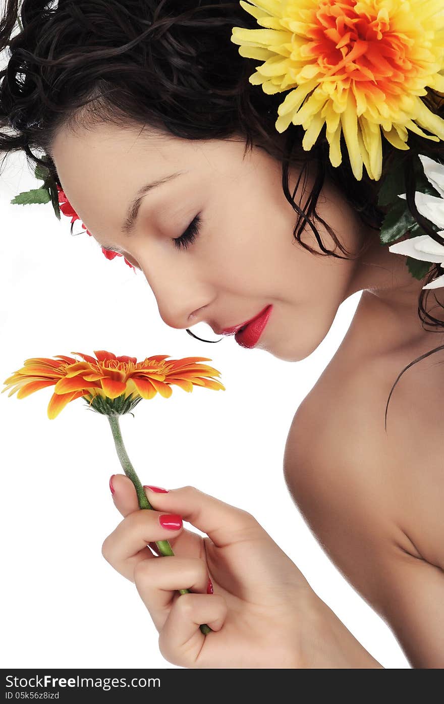 Photography of woman who smells flower with closed eyes in studio on white background. Photography of woman who smells flower with closed eyes in studio on white background