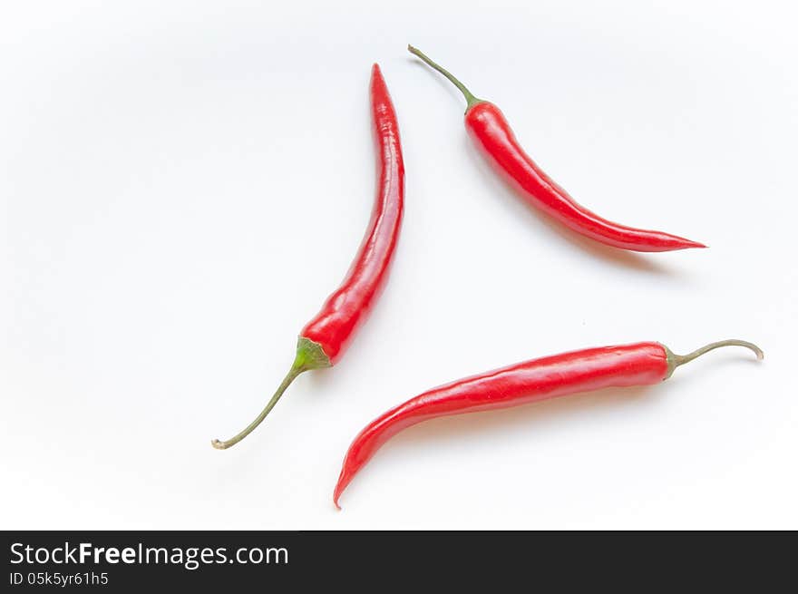 Three Chili On A White Background