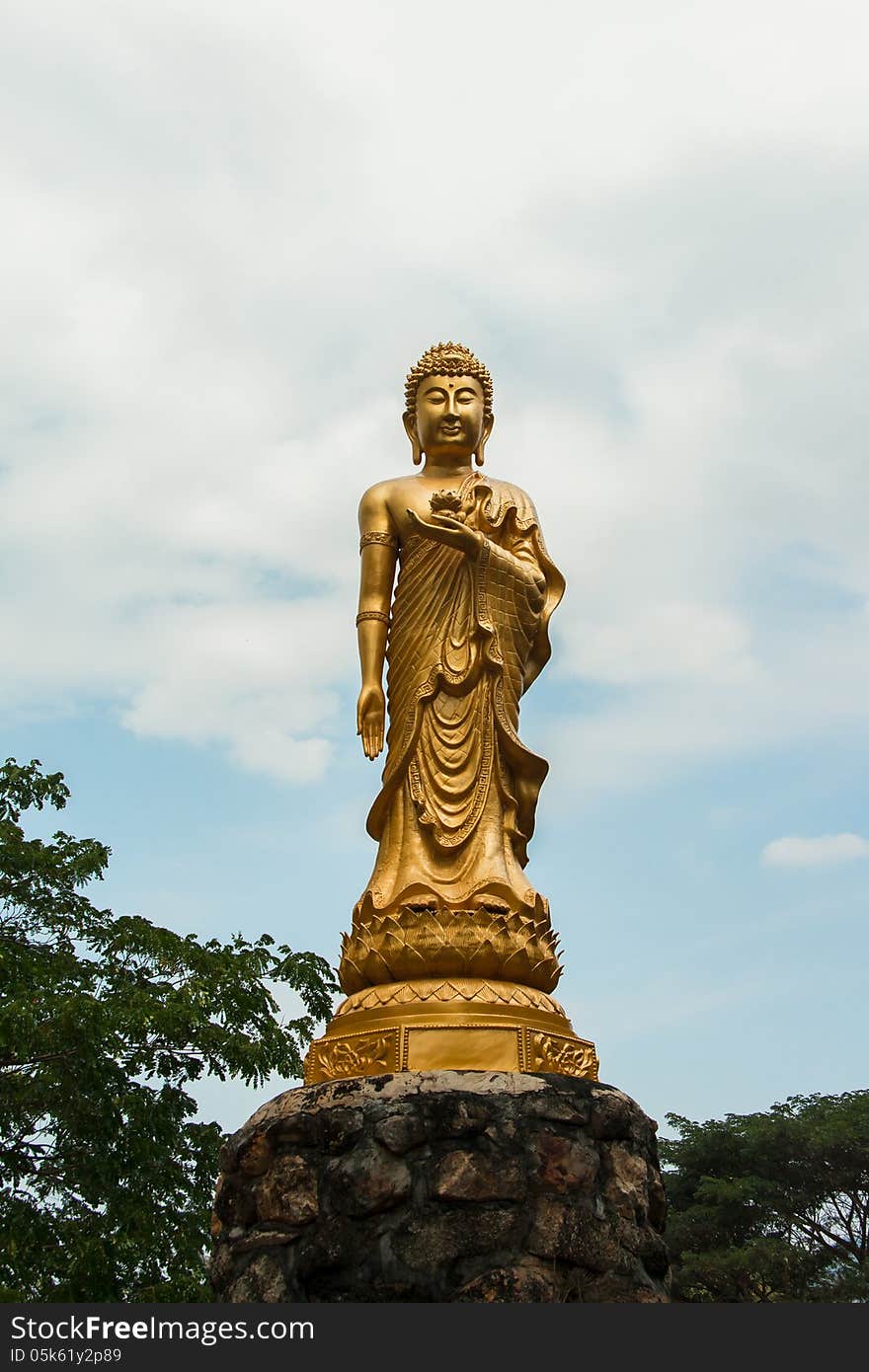 Golden buddha on blue sky. Golden buddha on blue sky