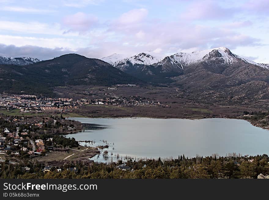 Views of the town and lake with snowy mountains