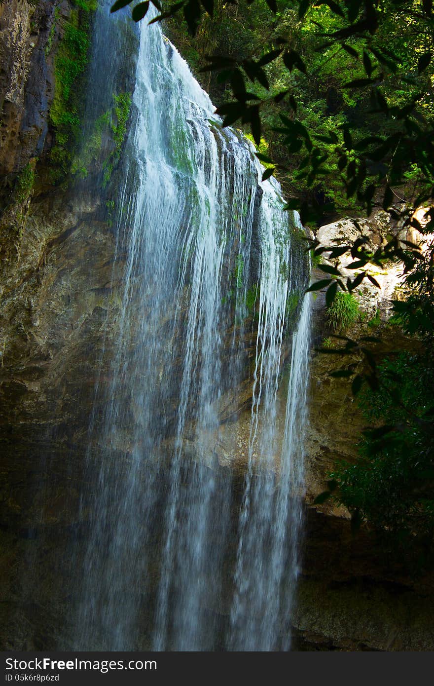 Detail of cascade waterfall in green area preserved