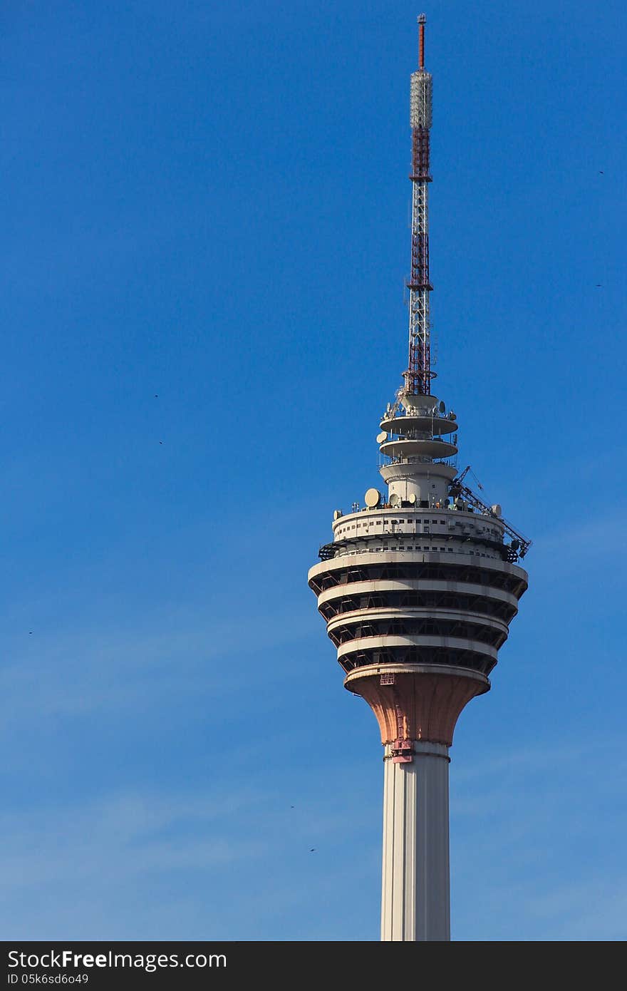 A view of KL telecommunications tower where a revolving restaurant is located at one of the tower levels. A view of KL telecommunications tower where a revolving restaurant is located at one of the tower levels.