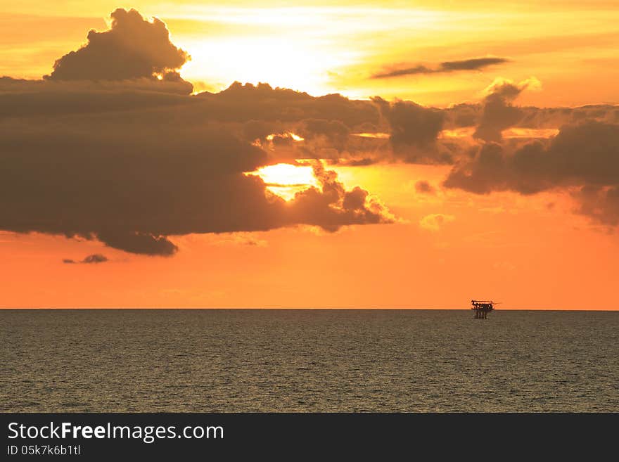 Offshore Production Platform in Sunset Time with Yellow Sky