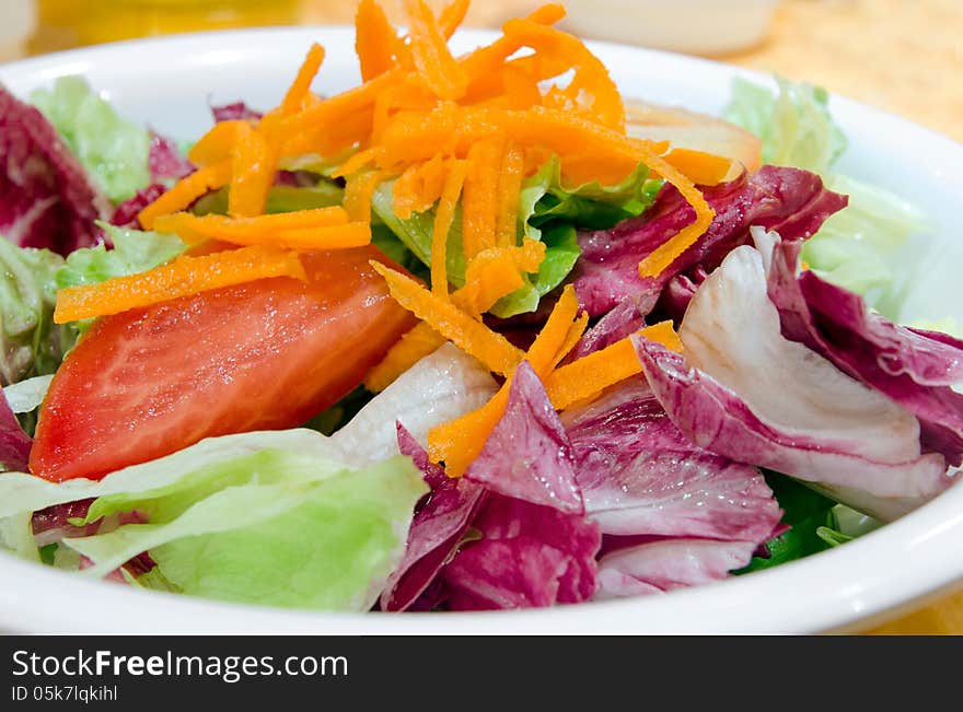 Simple garden salad with various fresh vegetables