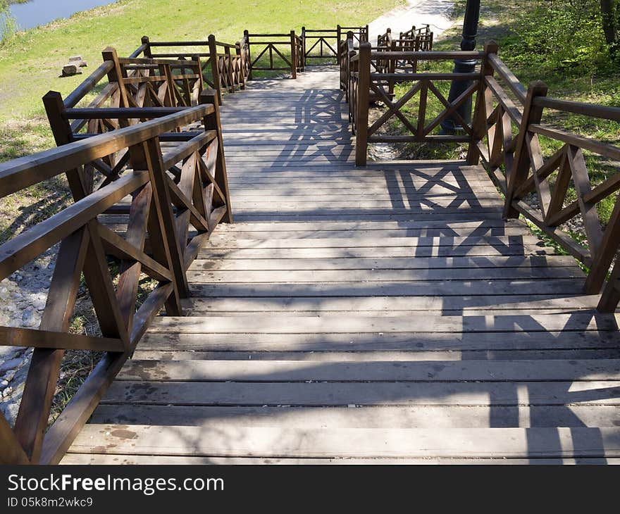 Scenic wooden stairs with massive handrails