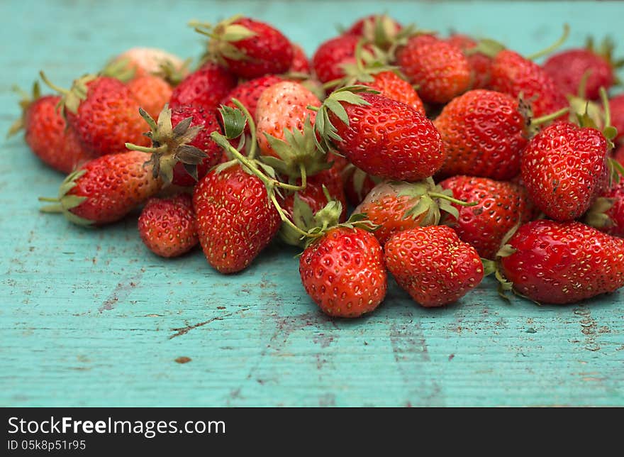 Strawberries on a wooden surface