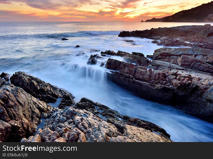 Sea waves lash line impact rock on the beach. Sea waves lash line impact rock on the beach