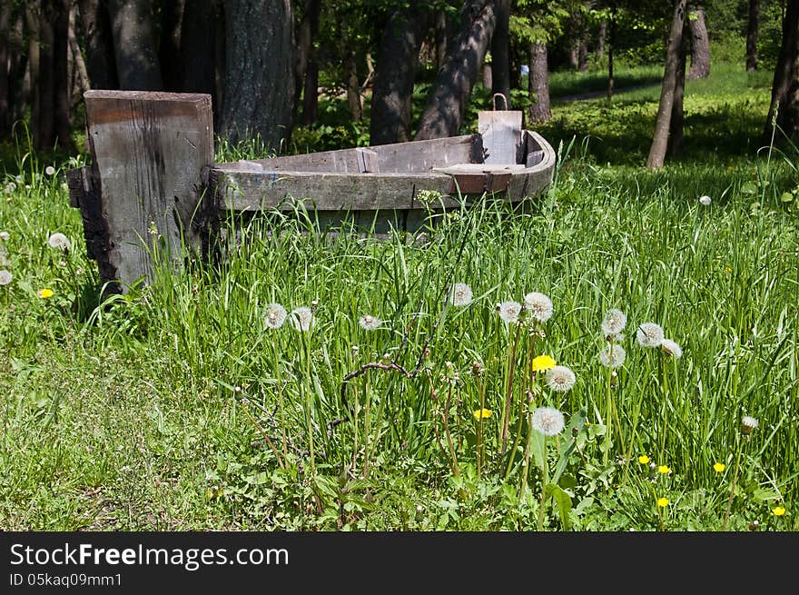 Old wooden boat on the grass