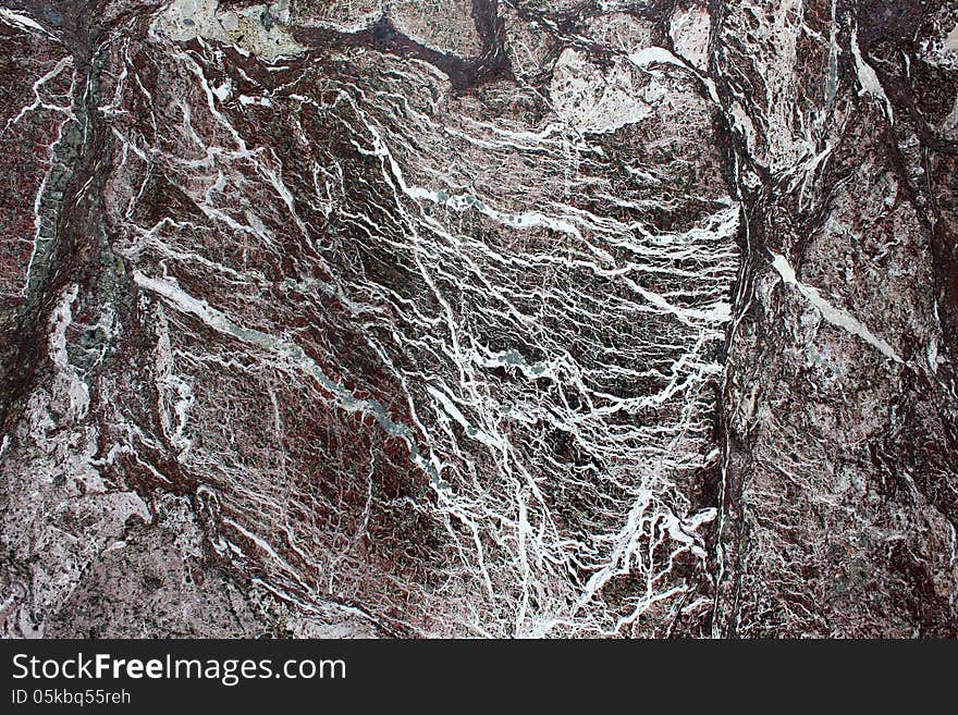 Smooth marble background with black,white and pink veins running through it. Smooth marble background with black,white and pink veins running through it.