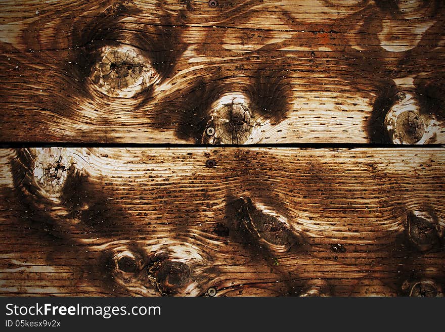 The brown wood texture with natural patterns. The brown wood texture with natural patterns