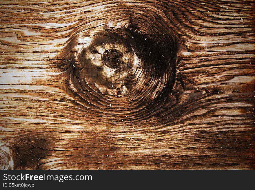 The brown wood texture with natural patterns. The brown wood texture with natural patterns