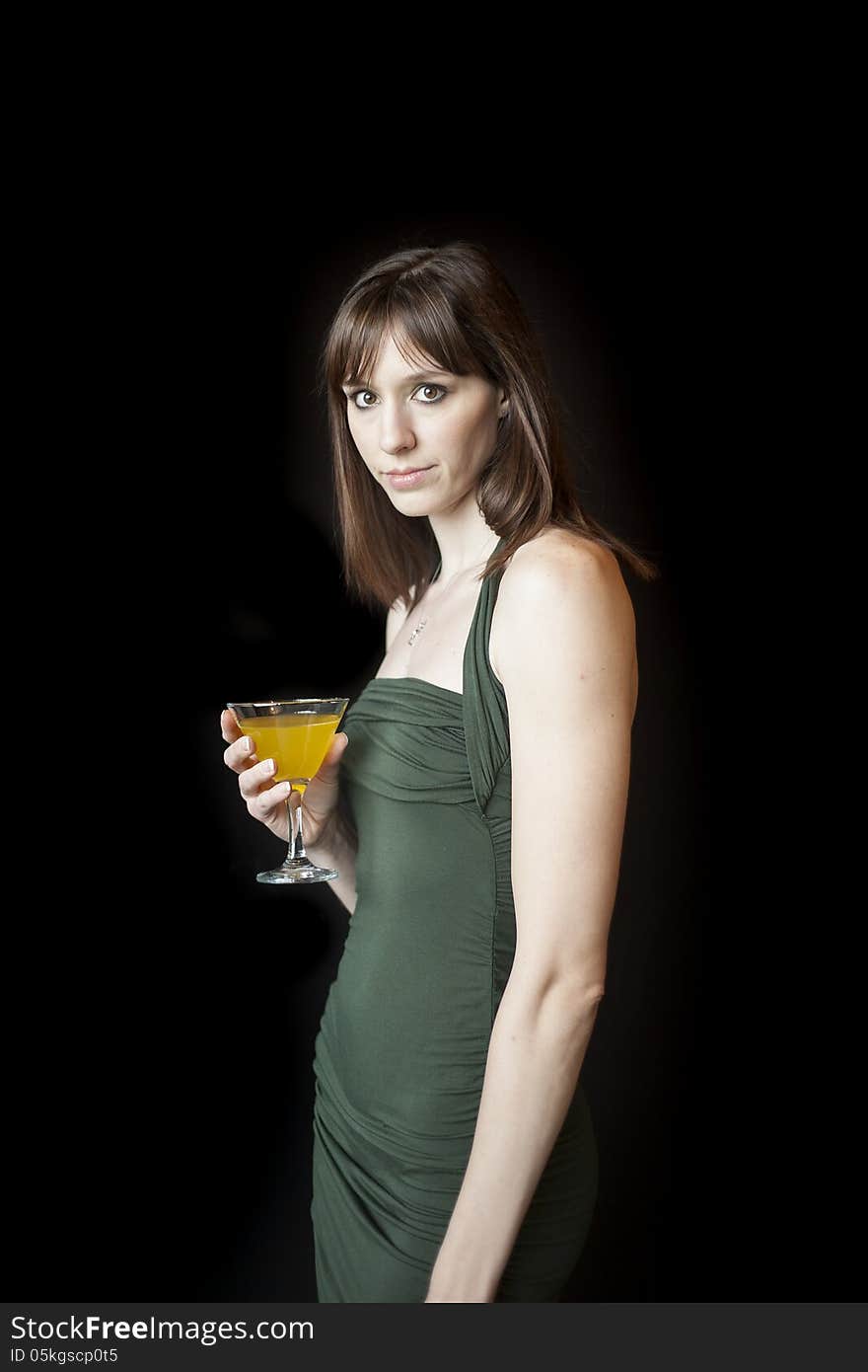 Beautiful young woman with dark brown hair and eyes against a black background. Beautiful young woman with dark brown hair and eyes against a black background.